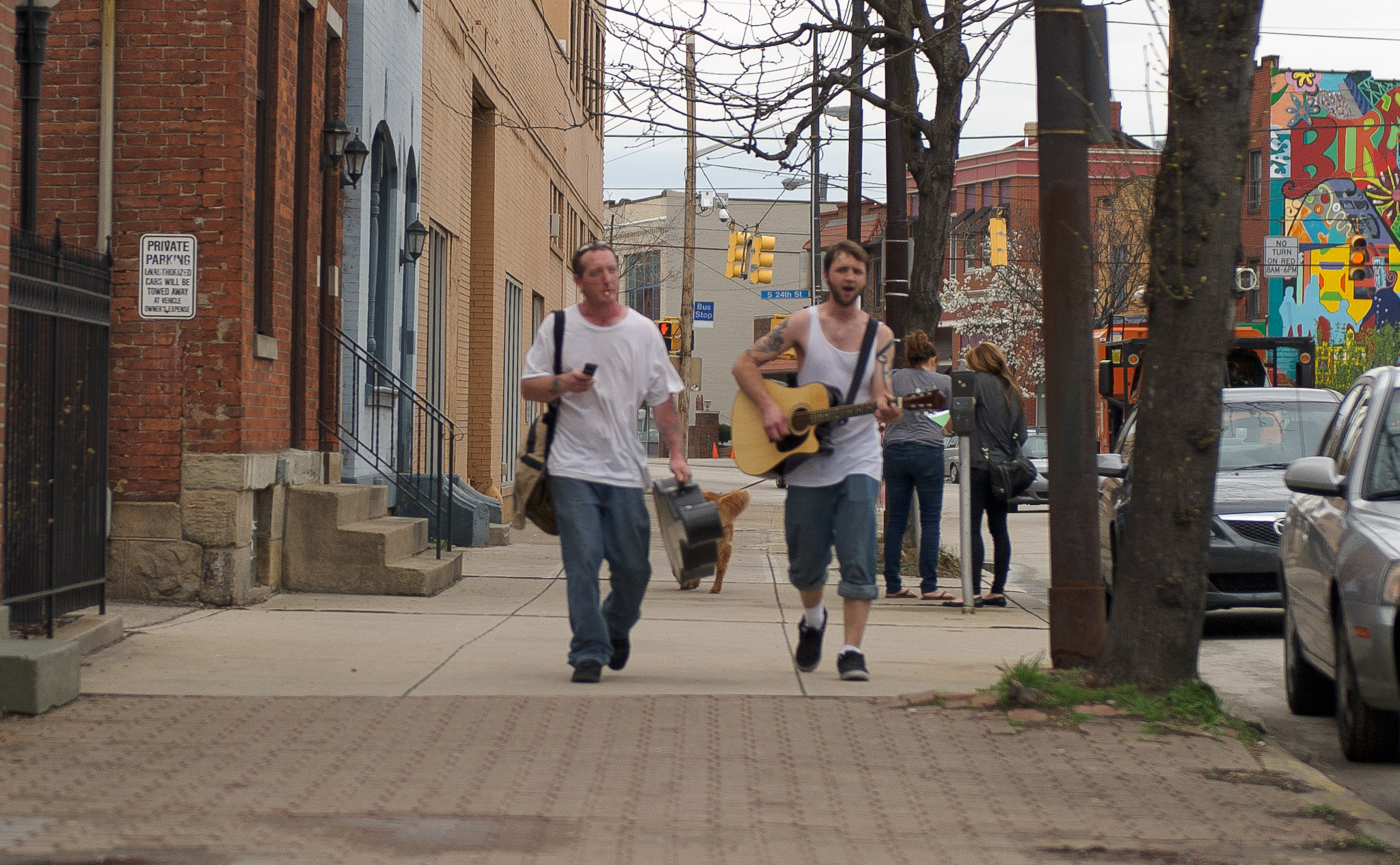 two pittsburgh yinzers on a sidewalk southside singing sublime