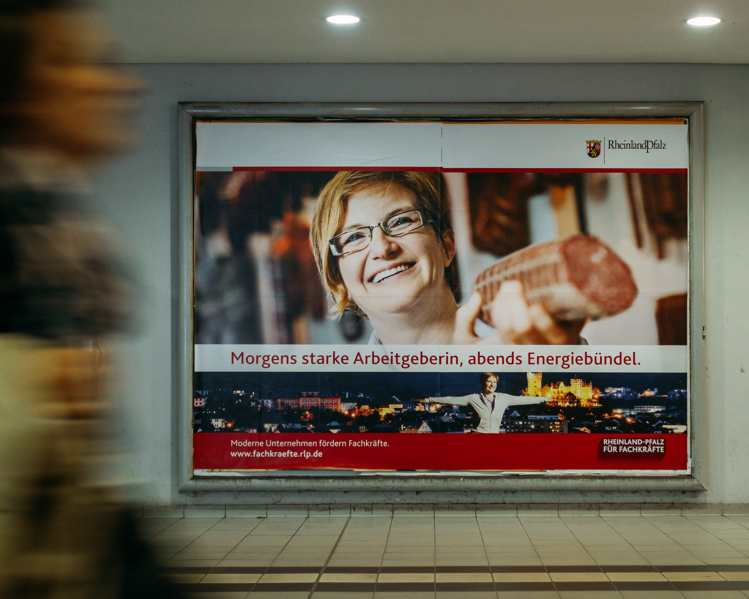 A sanguine woman, distracted by something over my shoulder to the left, presents me with a huge sausage on my arrival in Berlin