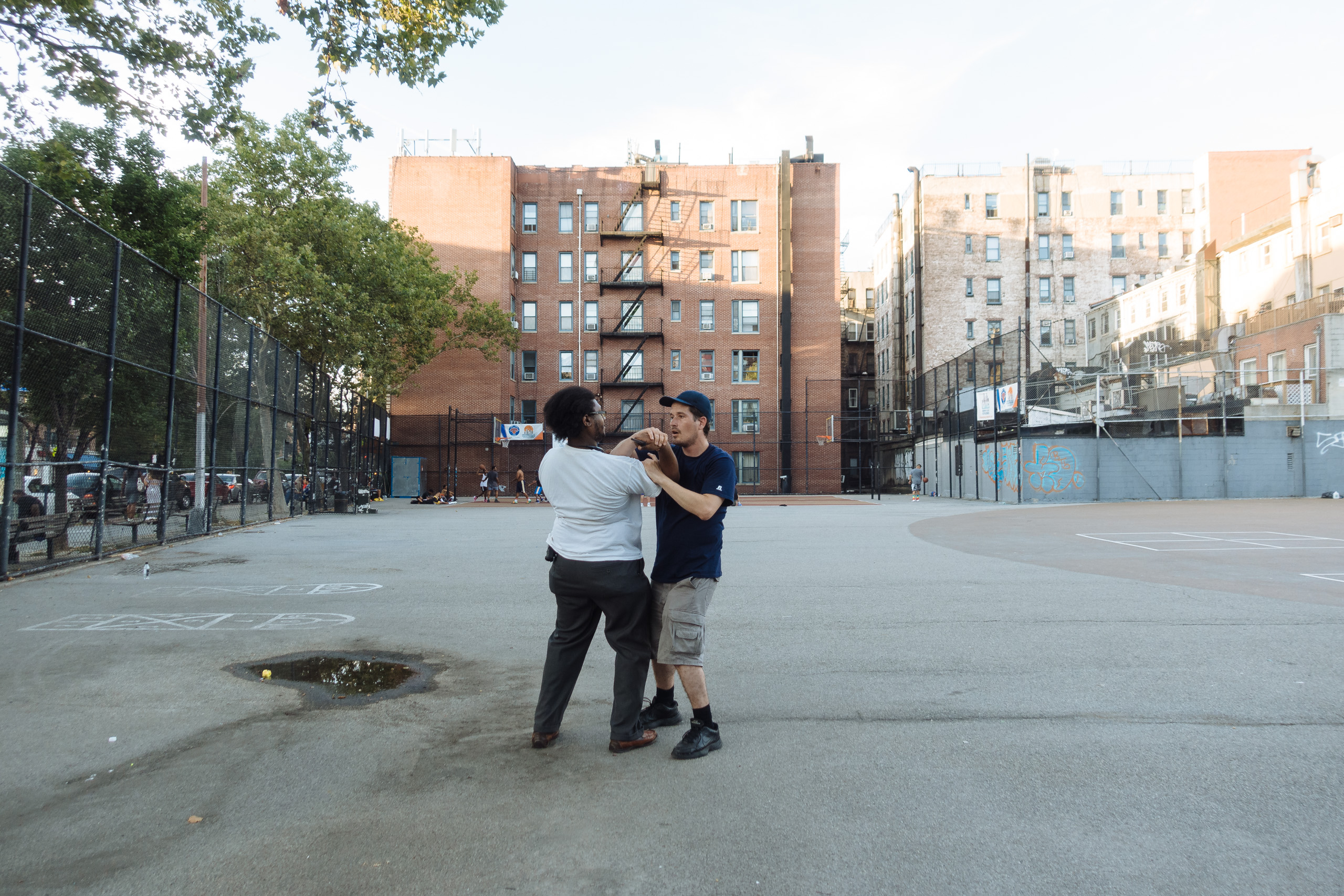 Men practice self-defense technique