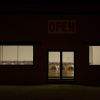 Laundromat storefront at night