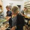 Surfers cooking in the kitchen