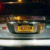 TACOSYUM on a license plate.