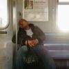 Subway sleeper on a Manhattan bound J train