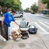 An electric scooter among other garbage