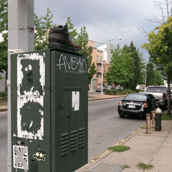 boot on traffic utility box at intersection