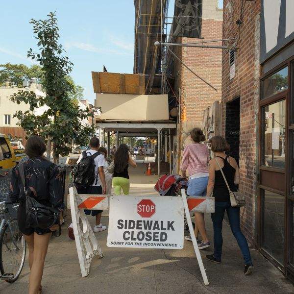 ignoring sign sidewalk closed brooklyn people
