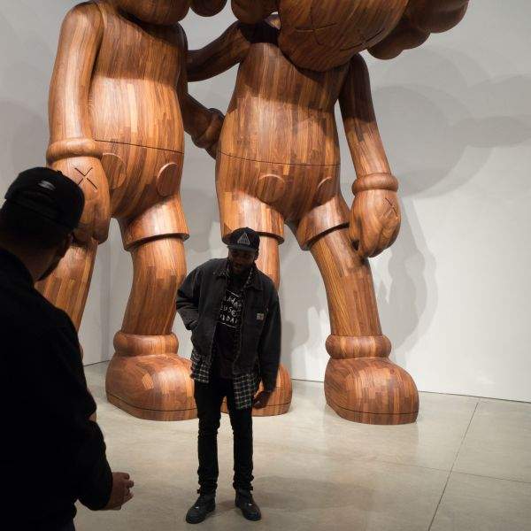 Posing in front of KAWS at Mary Boone