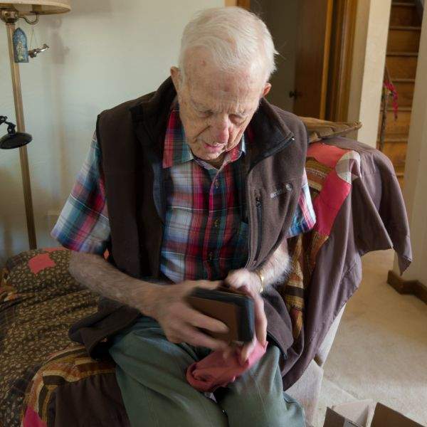 Pap sorting a stack of wallets