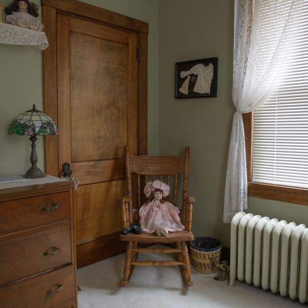 doll in rocking chair