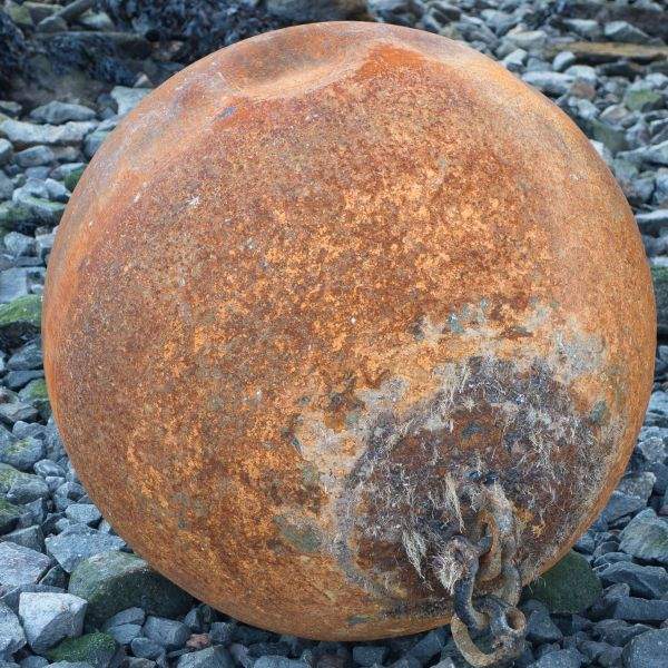 Rusty ball on the rocks