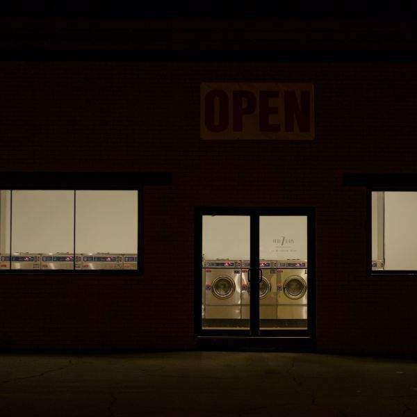 Laundromat storefront at night