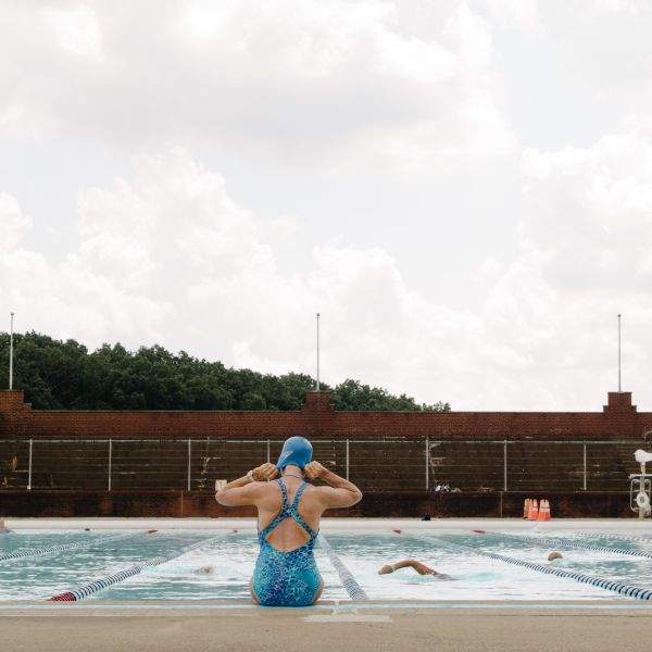 Ma puts on her swim cap.