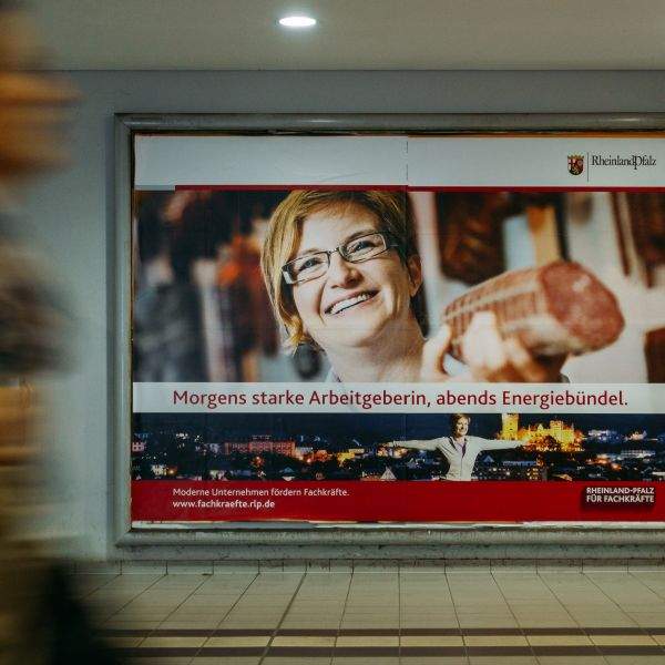 A sanguine woman, distracted by something over my shoulder to the left, presents me with a huge sausage on my arrival in Berlin