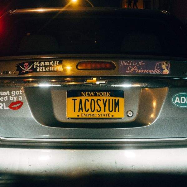TACOSYUM on a license plate.