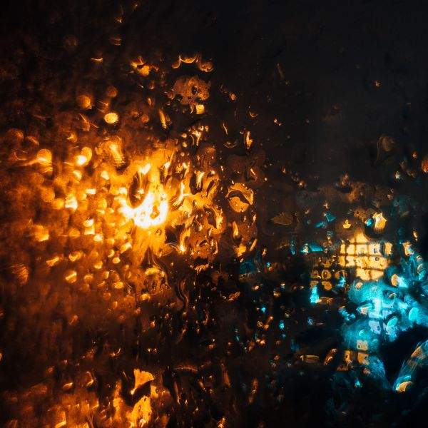 Rain on the window, focal point on the glass