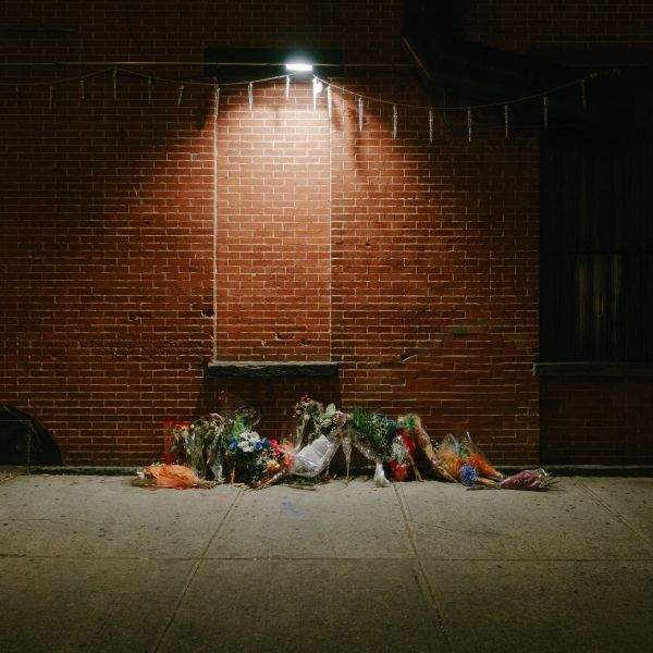 Floral memorial on the sidewalk on Thompkins at Myrtle