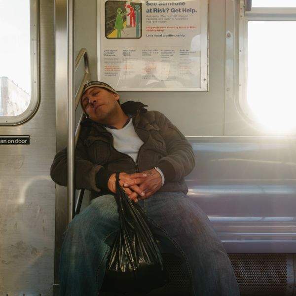 Subway sleeper on a Manhattan bound J train