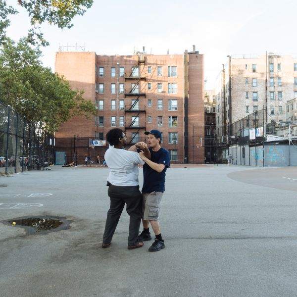 Men practice self-defense technique