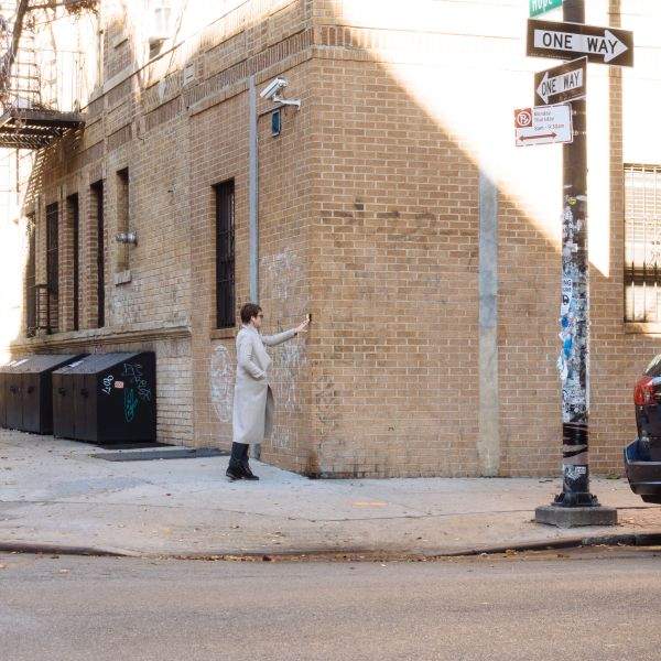 A woman has a conversation in Williamsburg, Brooklyn