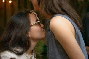 A guest evaluates the pheromone another guest was spritzed with.
