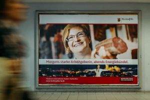 A sanguine woman, distracted by something over my shoulder to the left, presents me with a huge sausage on my arrival in Berlin