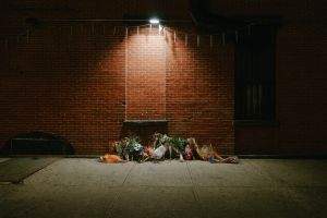Floral memorial on the sidewalk on Thompkins at Myrtle