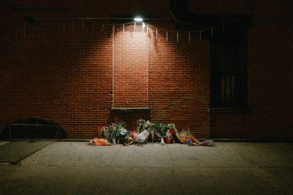 Floral memorial on the sidewalk on Thompkins at Myrtle