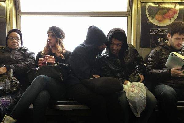 Commuters sharing secrets on J Train in Brooklyn Bed-Stuy