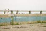 A ladder against a barrier along Beach Channel Drive
