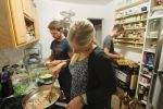 Surfers cooking in the kitchen