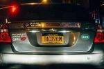 TACOSYUM on a license plate.