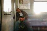 Subway sleeper on a Manhattan bound J train