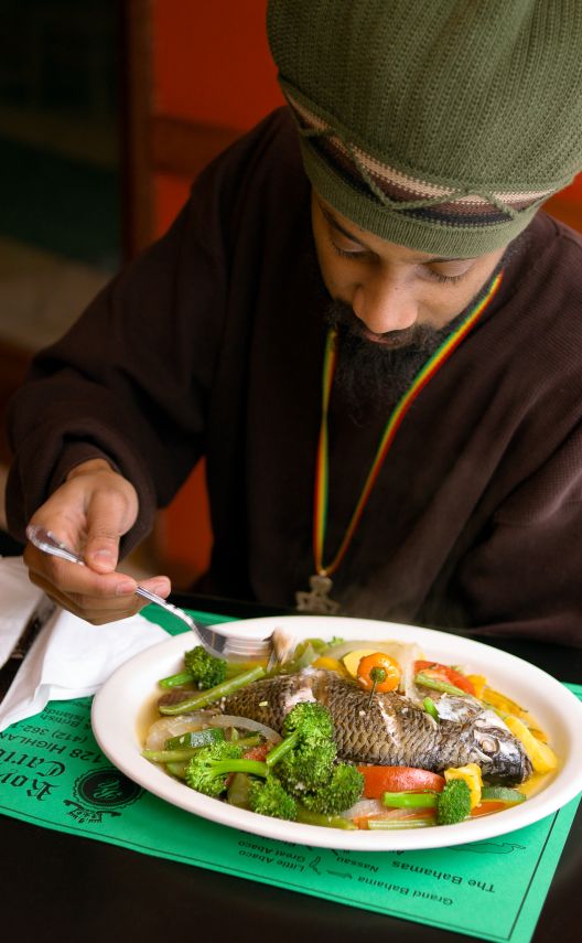 Customer eating Whole Fish at Royal Caribbean