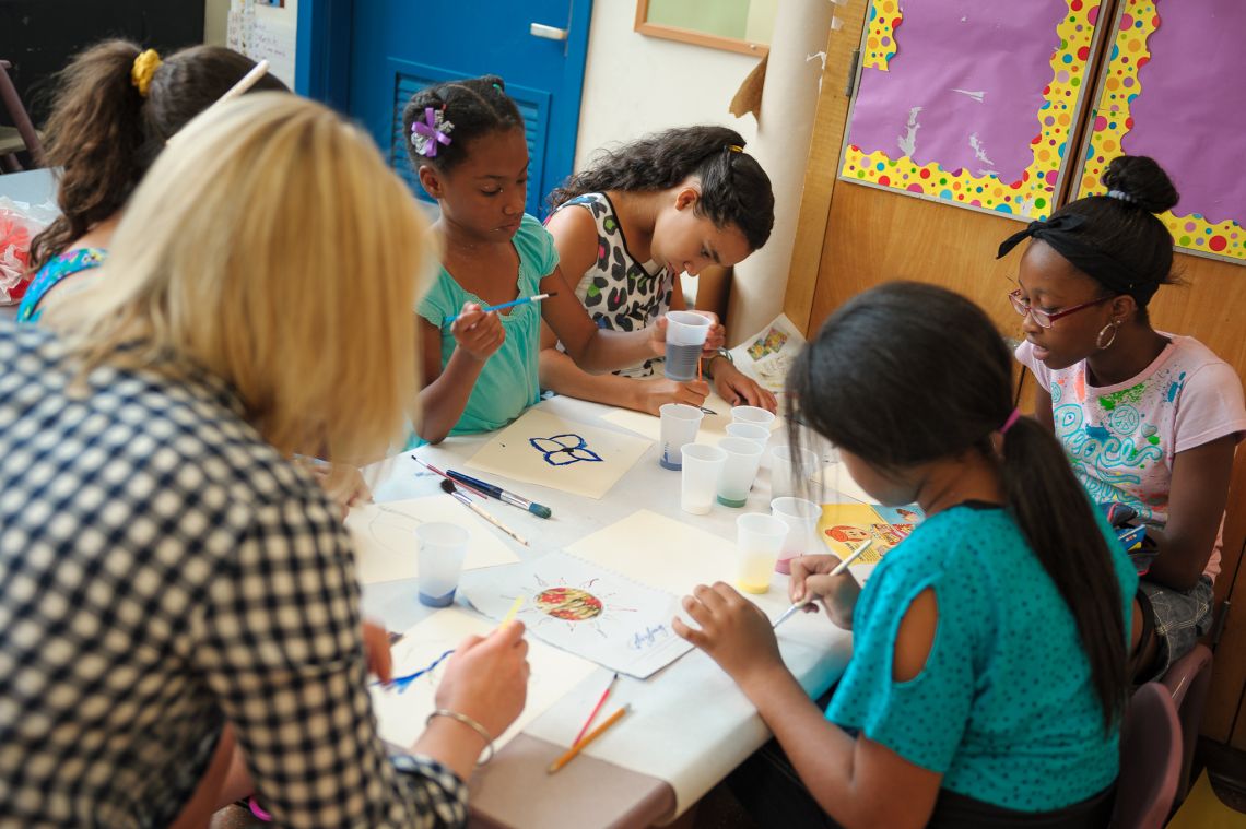 students working at art table