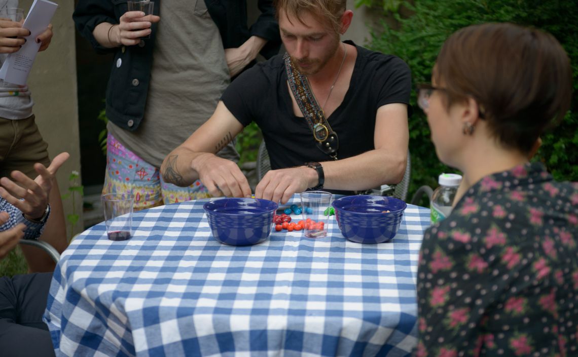 A guest sorts the available M&amp;M's for by color.