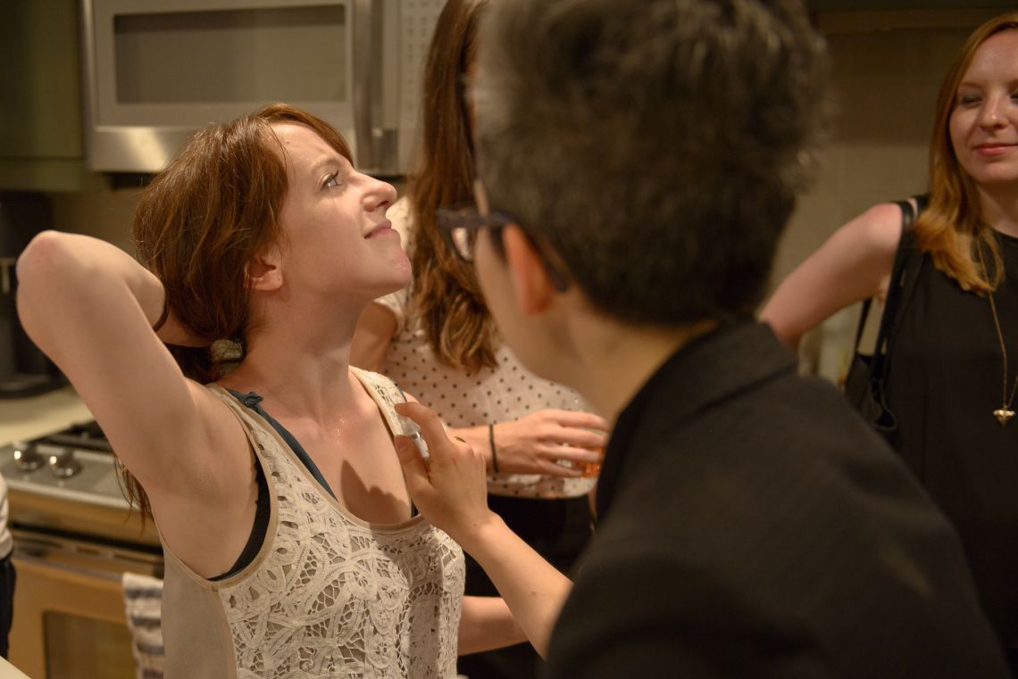 A guest is spritzed with pheromone for women