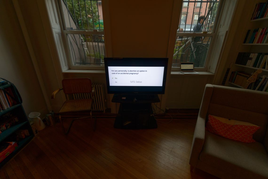 A LCD display showed questions from the OKCupid website