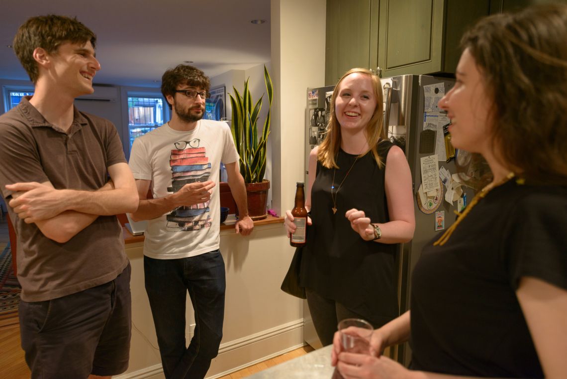 Guests mingle and chat.