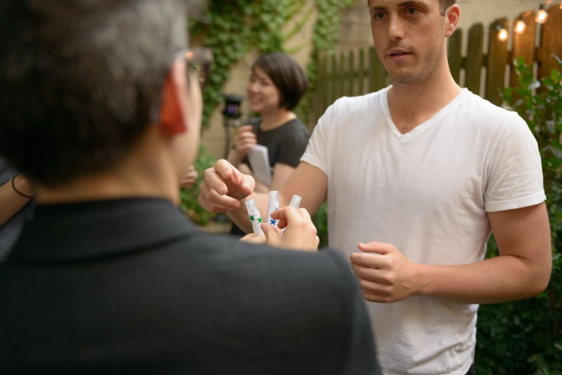 A guest chooses the pheromone he'll soon be wearing.