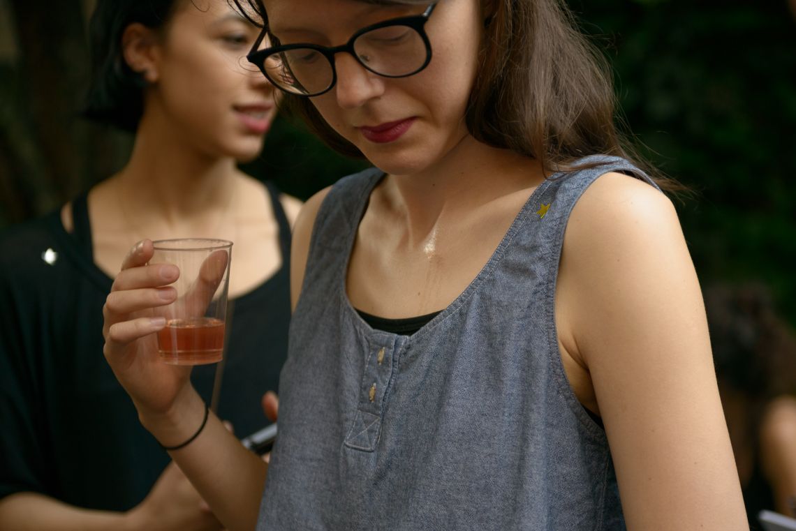 A guest evaluates the pheromone she was spritzed with.