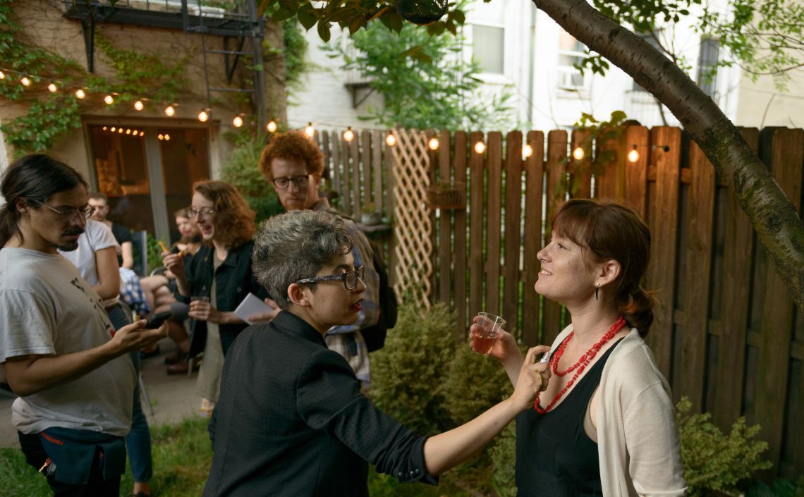 A guest is spritzed with a pheromone for women.