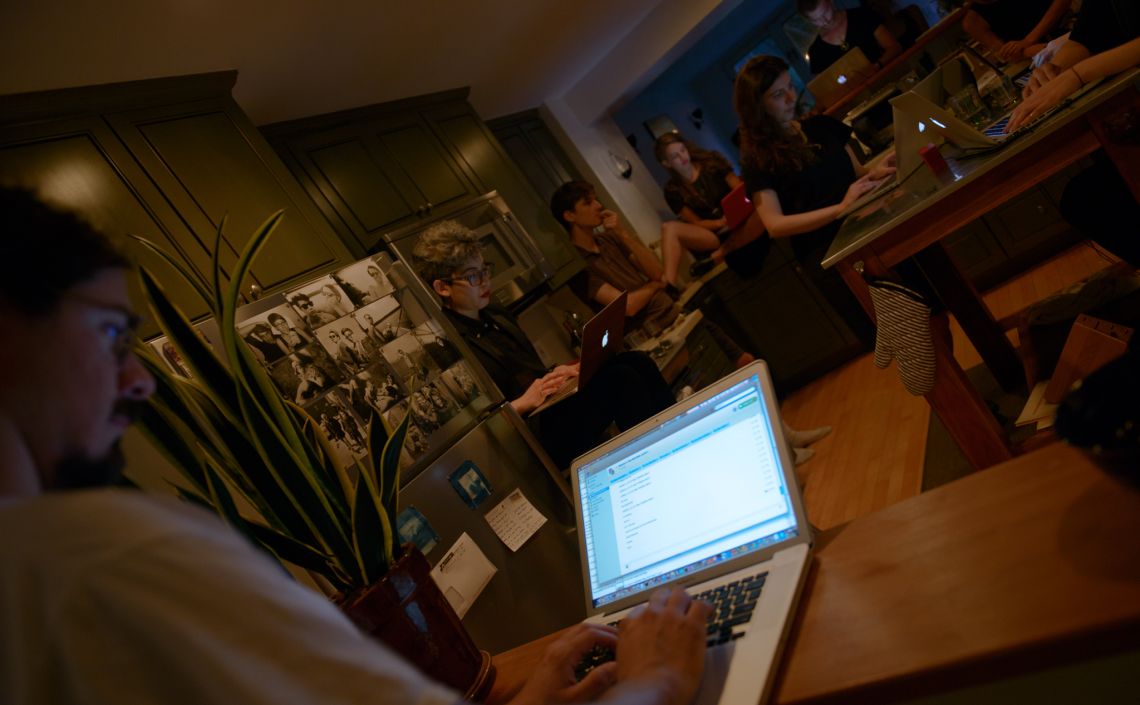 Performers at their laptops in Body Piece (2014)