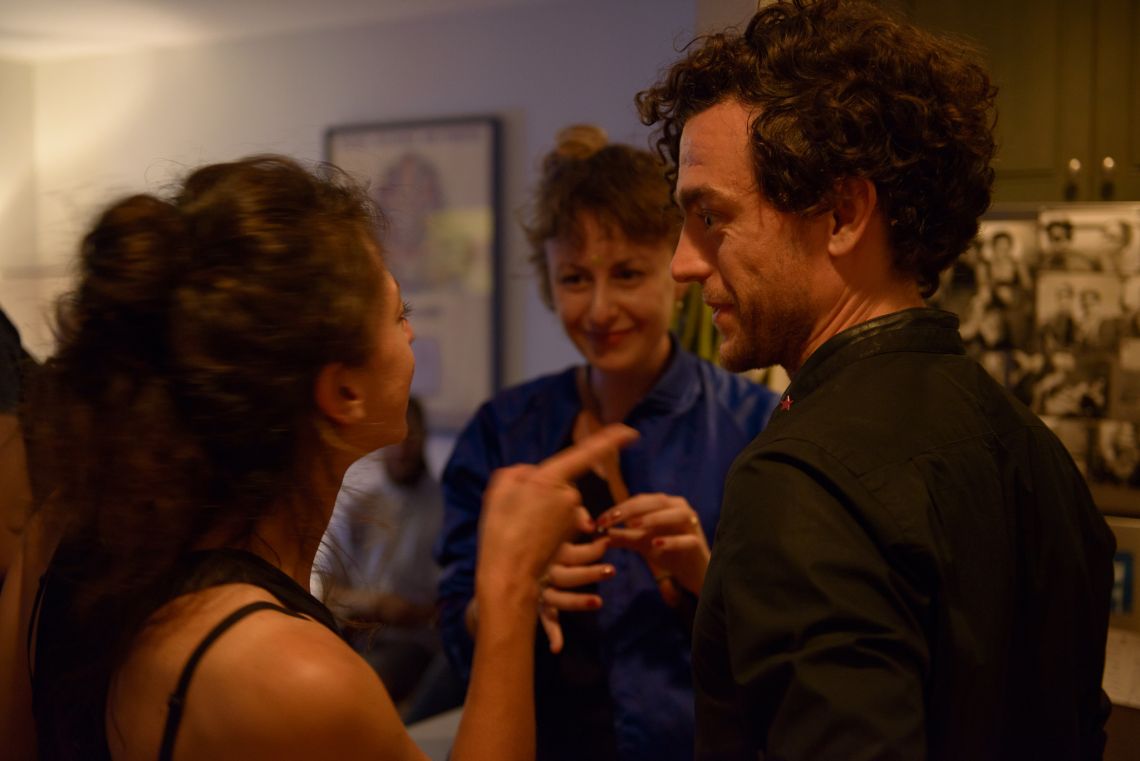 Guests mingle and chat.