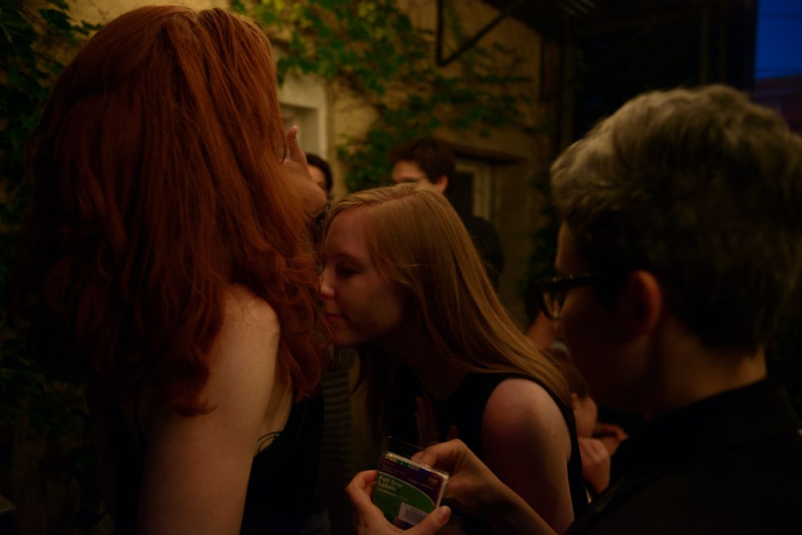 A guest evaluates the pheromone another guest was spritzed with.