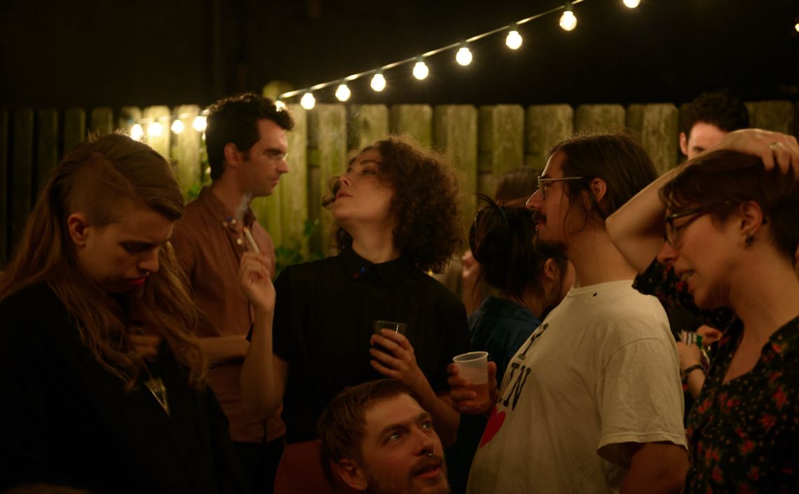 A guest blows a puff of smoke