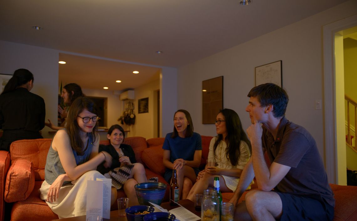 Guests mingle and chat.