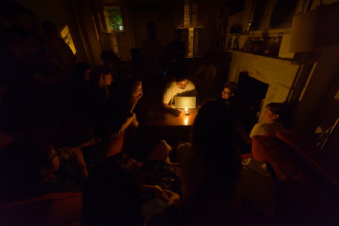 Daniel Fishkin begins his second piece of the night by lighting a candle