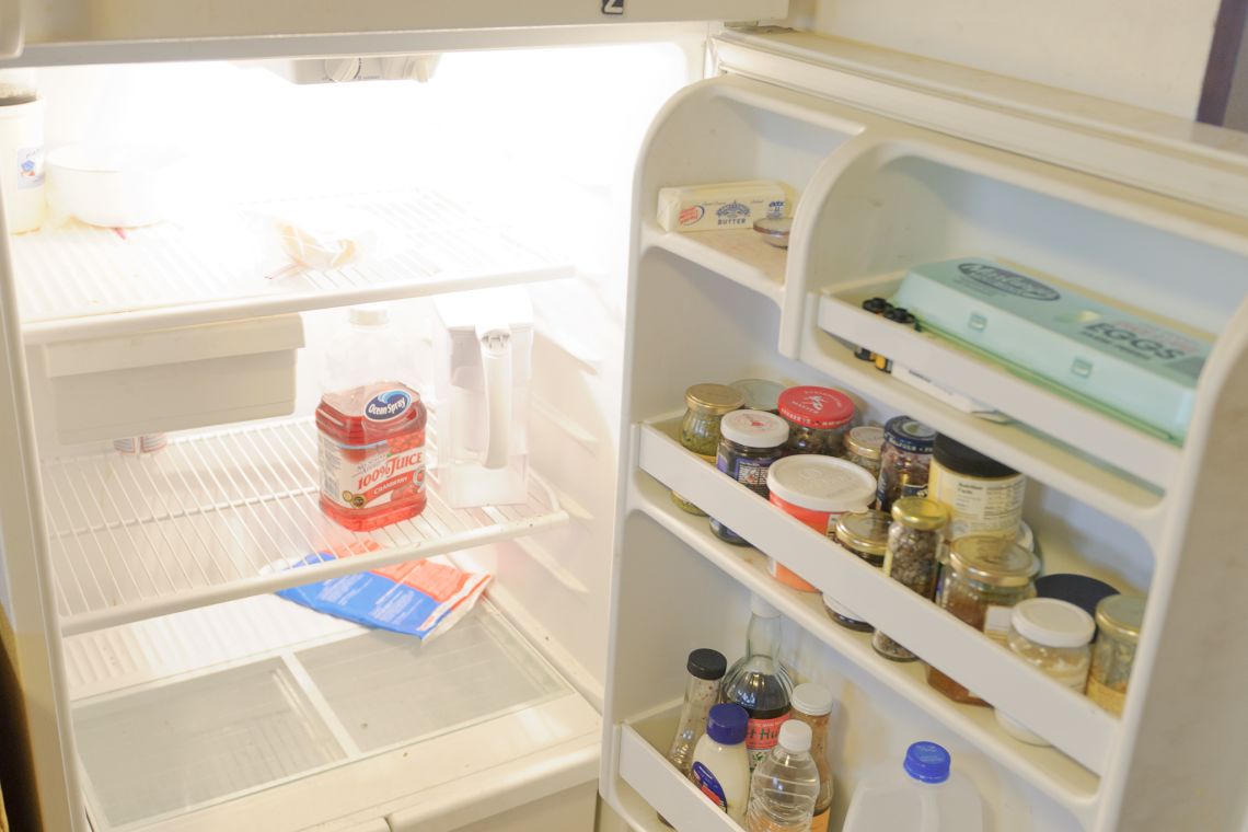barren refrigerator empty ice pack cranberry juice