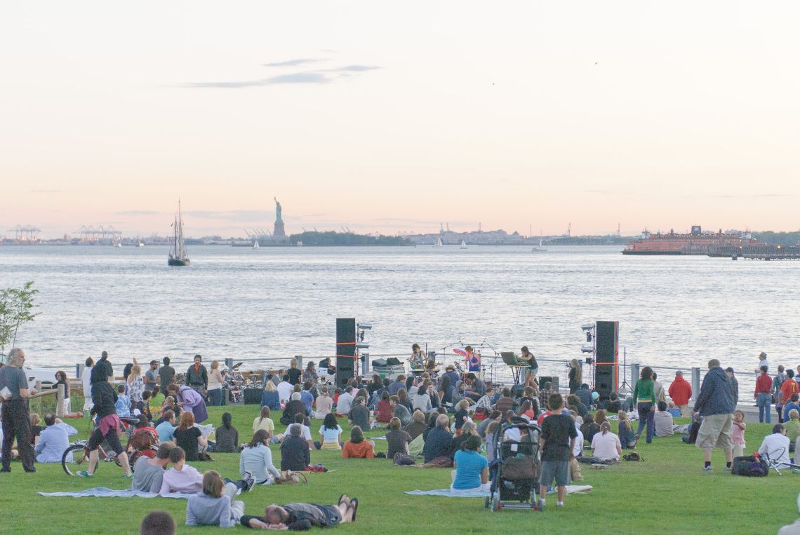 brooklyn bridge park walt whitman festival july grass statue of liberty