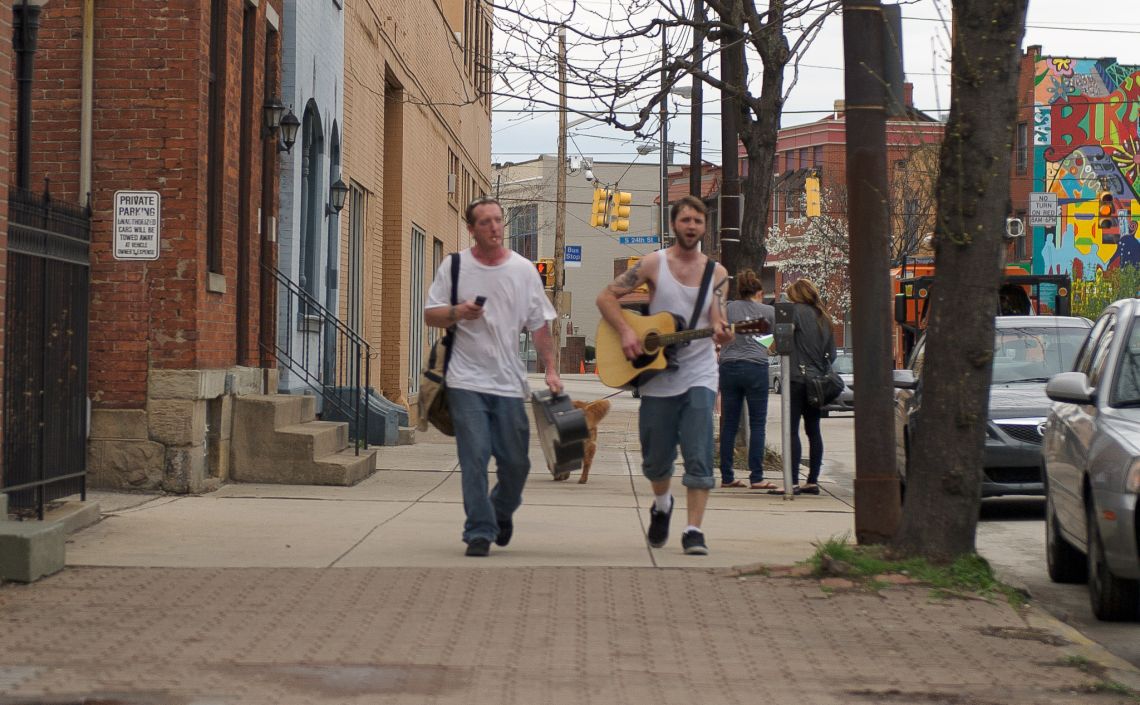two pittsburgh yinzers on a sidewalk southside singing sublime